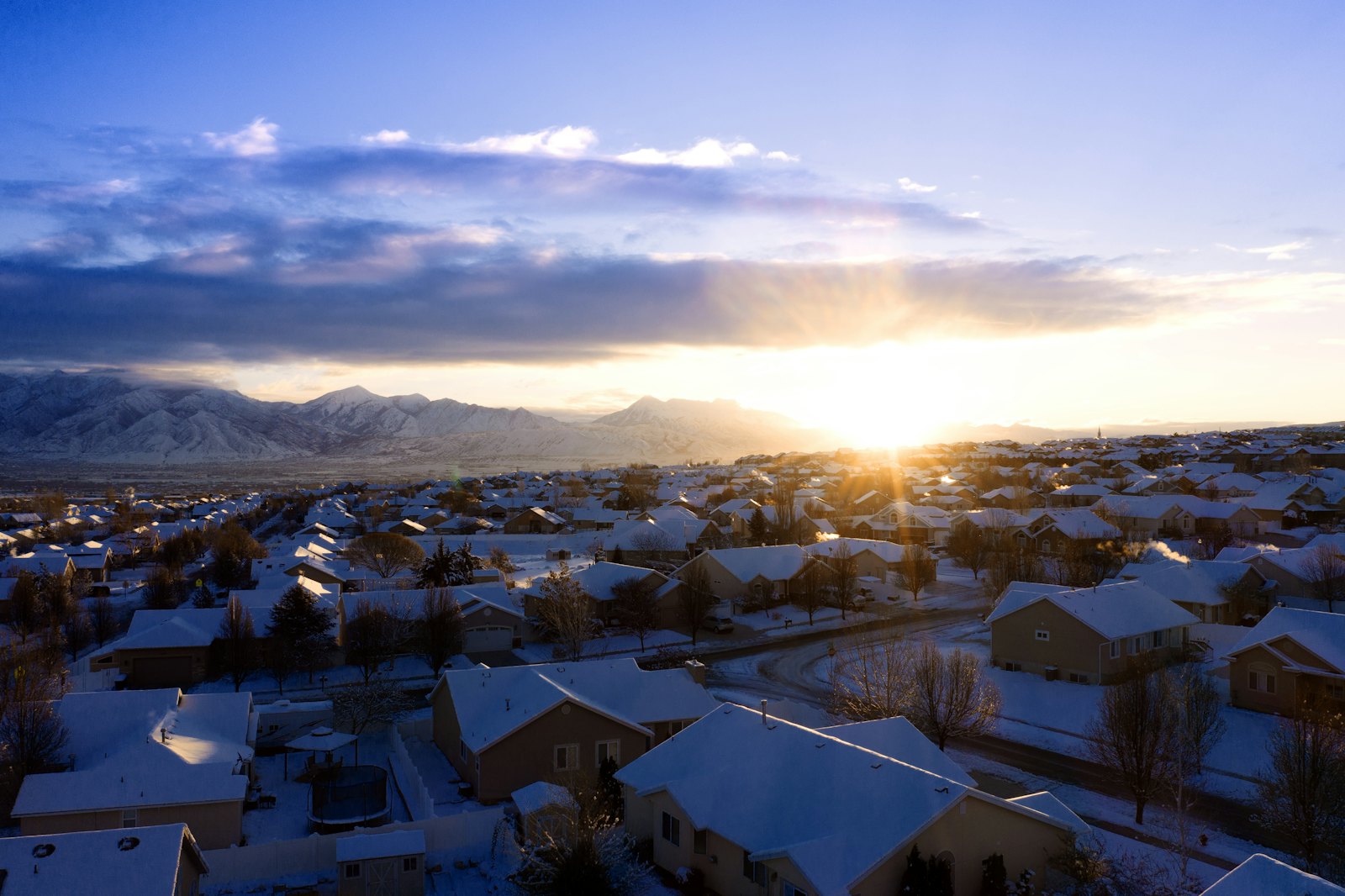 Snow-covered Utah neighborhood at golden hour