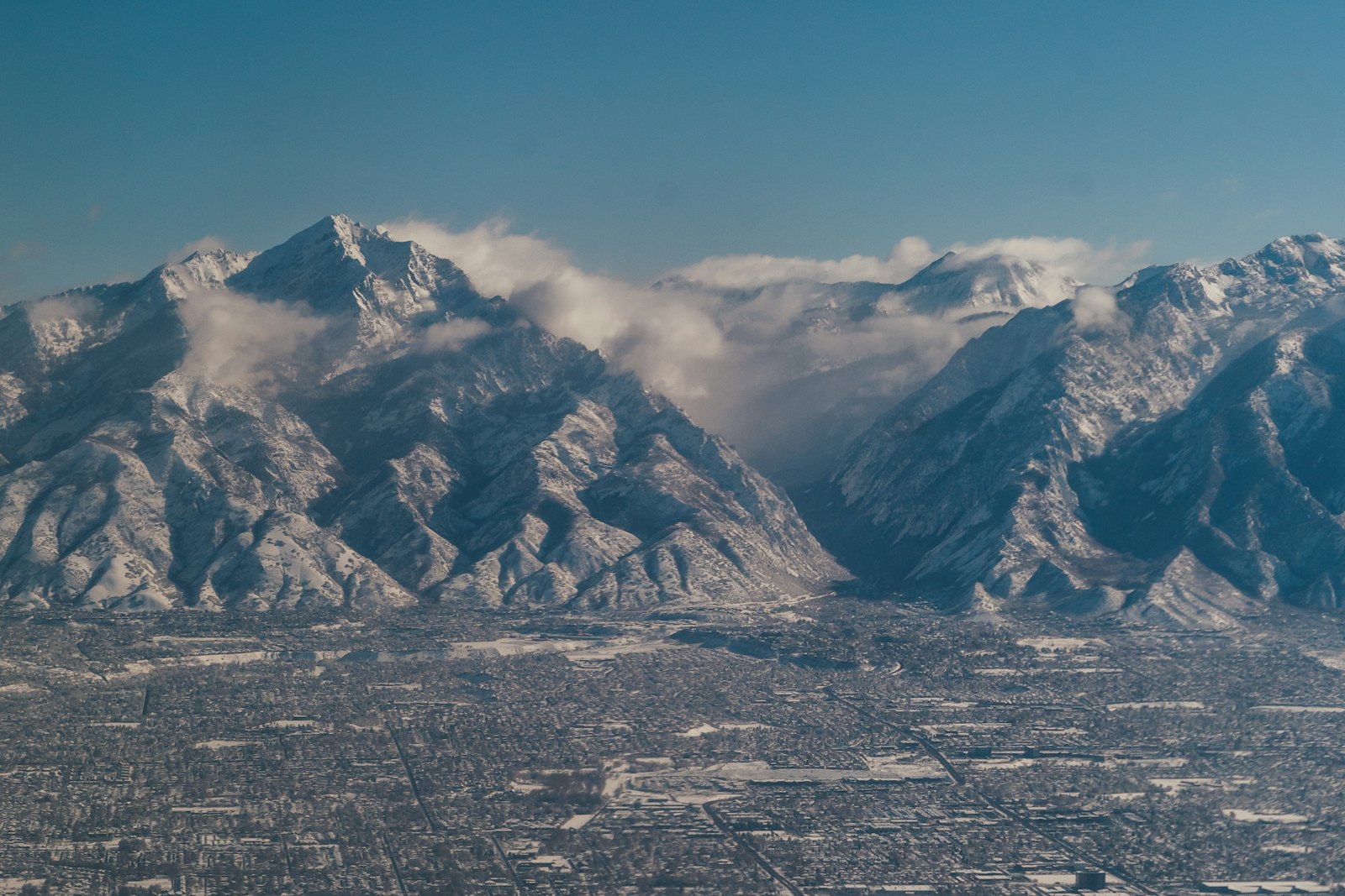 Aerial view of Wasatch Front neighborhoods below the Wasatch Mountains